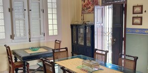 Enjoy meals in this dining area with a glass-top table and comfortable chairs.