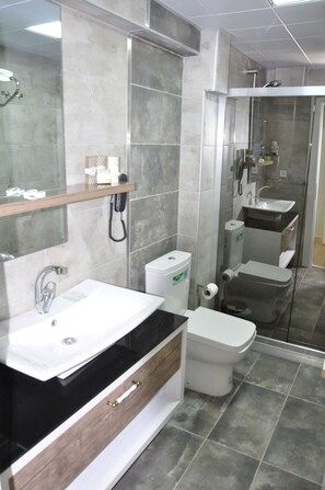 Shower, rainfall showerhead, slippers, towels