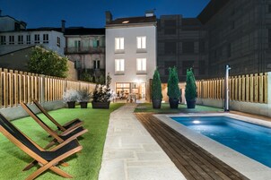 Seasonal outdoor pool, open 10 AM to 9 PM, pool umbrellas, sun loungers