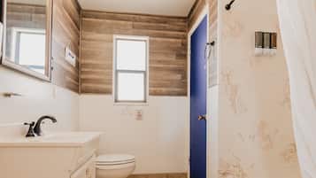Family Apartment, 1 Bedroom | Bathroom | Combined shower/tub, free toiletries, hair dryer, towels