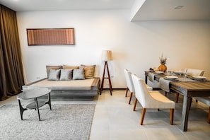 Premier Suite | Living area | 40-inch Smart TV with digital channels, TV