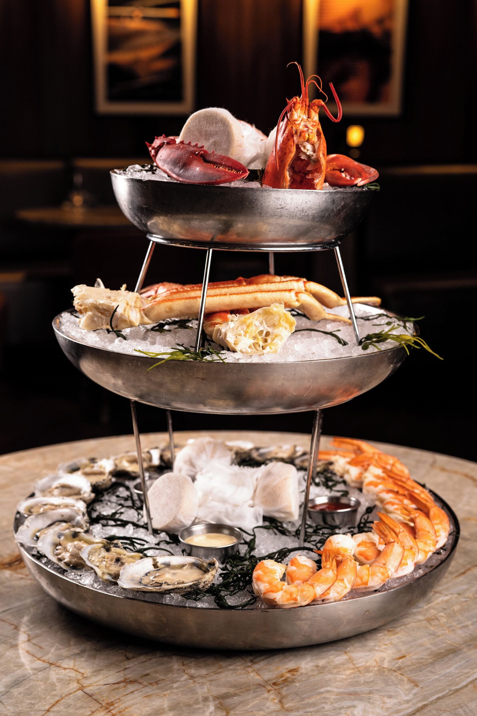 A seafood display with various types of seafood arranged on ice.