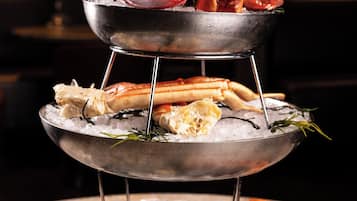 A seafood display with various types of seafood arranged on ice.