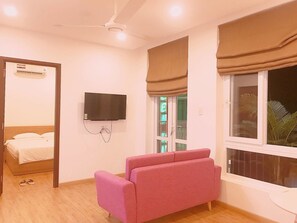23-inch flat-screen TV with cable channels, TV - Crown Apartment (Ho Chi Minh City)