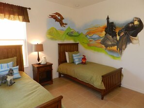 A bedroom with two beds, a nightstand, a lamp, and a mural on the wall. - Sm215701 - Watersong - 5 Bed 4 Baths Villa (Davenport)