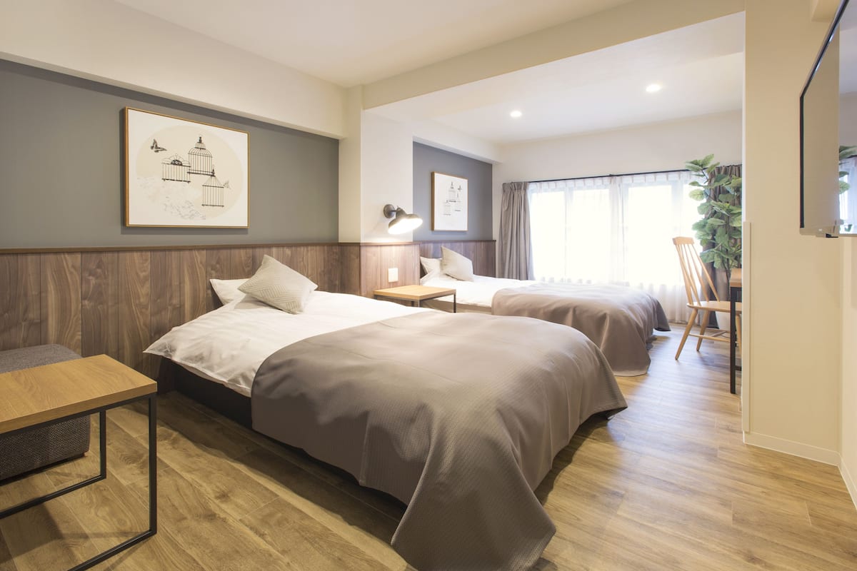 Deluxe Twin Room, Non Smoking | Down comforters, in-room safe, individually decorated
