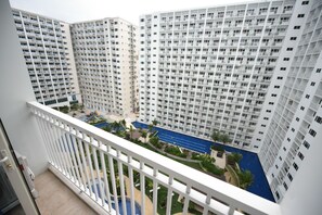 Apartment, 1 Bedroom, Accessible, Pool View | Balcony view - USP Suites at Shore Residences (Pasay)