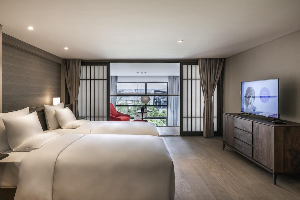 Svit Deluxe - 2 enkelsängar | Värdeförvaringsskåp på rummet och individuell inredning