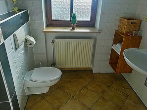 Shower, deep-soaking bathtub, hair dryer, towels