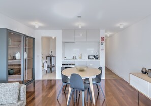 Deluxe Apartment, 1 Queen Bed, River View | Living room | Flat-screen TV