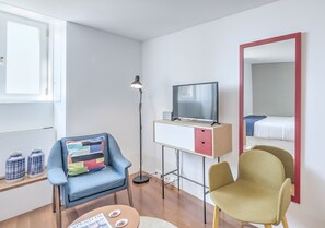 Superior Studio, River View | Living room | Flat-screen TV