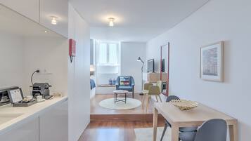 Superior Studio, River View | Living area | Flat-screen TV