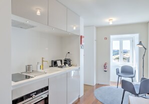 Standard Studio, River View | Private kitchen | Full-size fridge, microwave, oven, stovetop