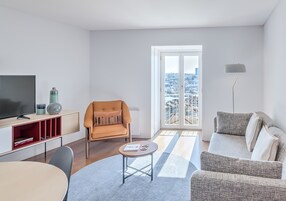 Premium Apartment, 1 Queen Bed, River View | Living room | Flat-screen TV