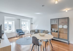 Deluxe Apartment, 1 Queen Bed, River View | Living area | Flat-screen TV