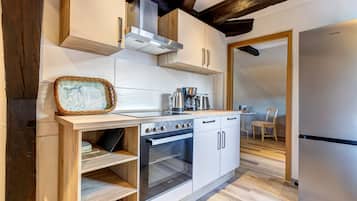 Apartment, 2 Bedrooms | Private kitchen | Full-size fridge, stovetop, electric kettle, toaster