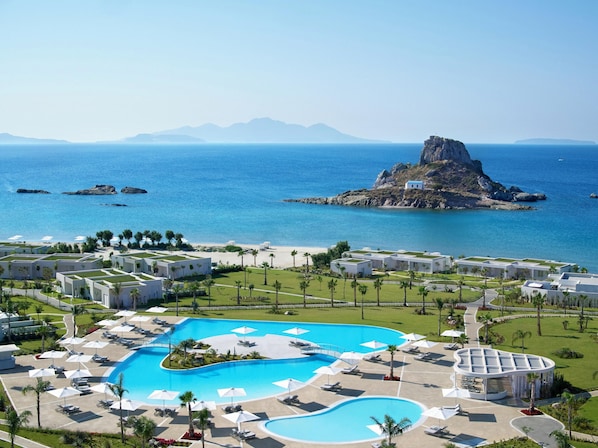 Indoor pool, outdoor pool, free pool cabanas, pool umbrellas