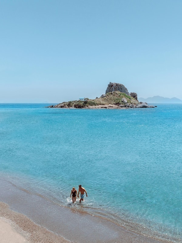 Private beach, white sand, sun loungers, beach umbrellas