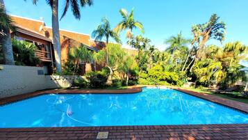 Outdoor pool, open 8:00 AM to 8:00 PM, pool loungers