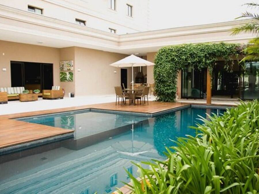 Outdoor pool, open 7:00 AM to 10:00 PM, pool loungers