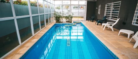 Indoor pool, open 9 AM to 9 PM, pool loungers