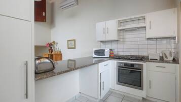 Classic Villa, 2 Bedrooms | Private kitchen | Microwave, electric kettle, toaster, cookware/dishes/utensils