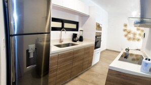 Apartment | Private kitchen | Coffee/tea maker, full-sized fridge, microwave, oven - Apartment Icono Playa by OT (Playa del Carmen)