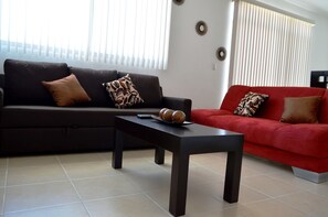 City Apartment, 2 Bedrooms | Living room | Flat-screen TV