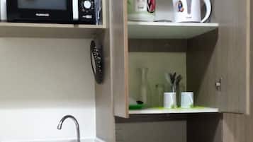Full-sized fridge, microwave, rice cooker, cookware/dishes/utensils