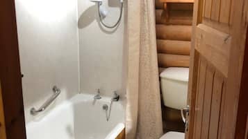 Separate bathtub and shower, towels