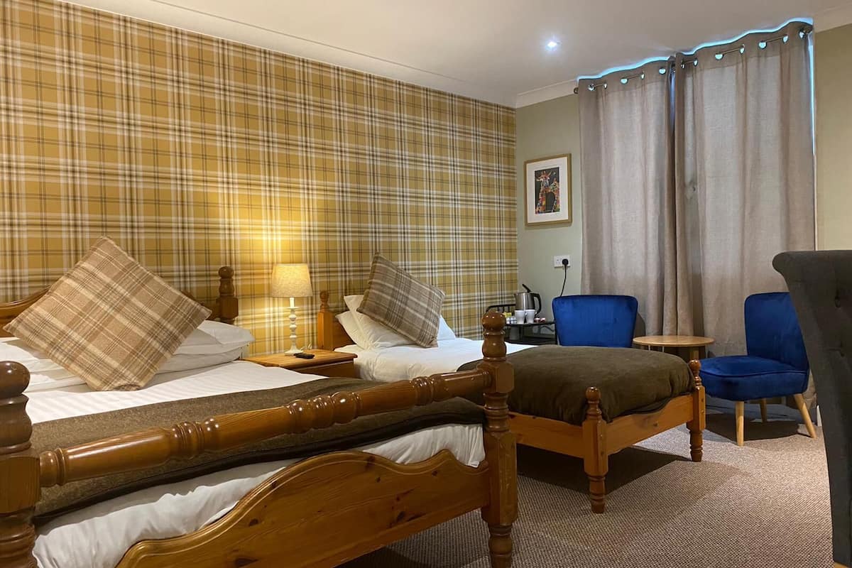 family room | 1 bedroom, individually decorated, individually furnished, desk