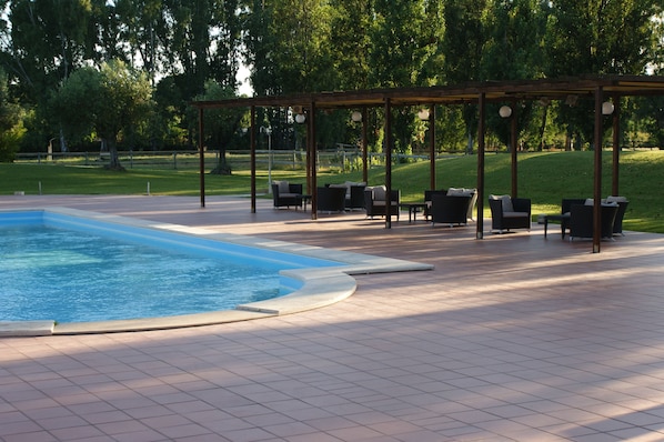 Outdoor pool, open 9 AM to 6:30 PM, sun loungers