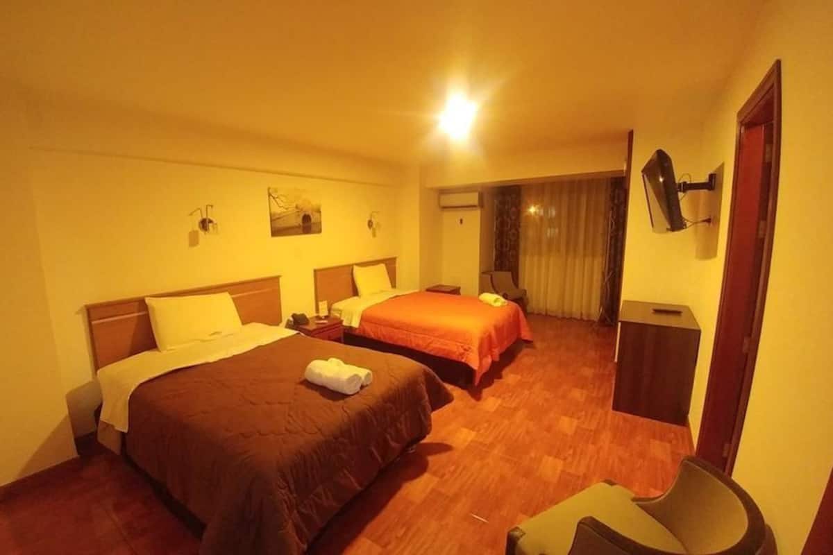 Family Twin Room | Minibar, in-room safe, desk, iron/ironing board