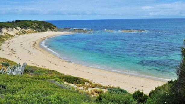 A beach with clear turquoise waters and a sandy shore. - Kilcunda Ocean View Motel (Kilcunda)