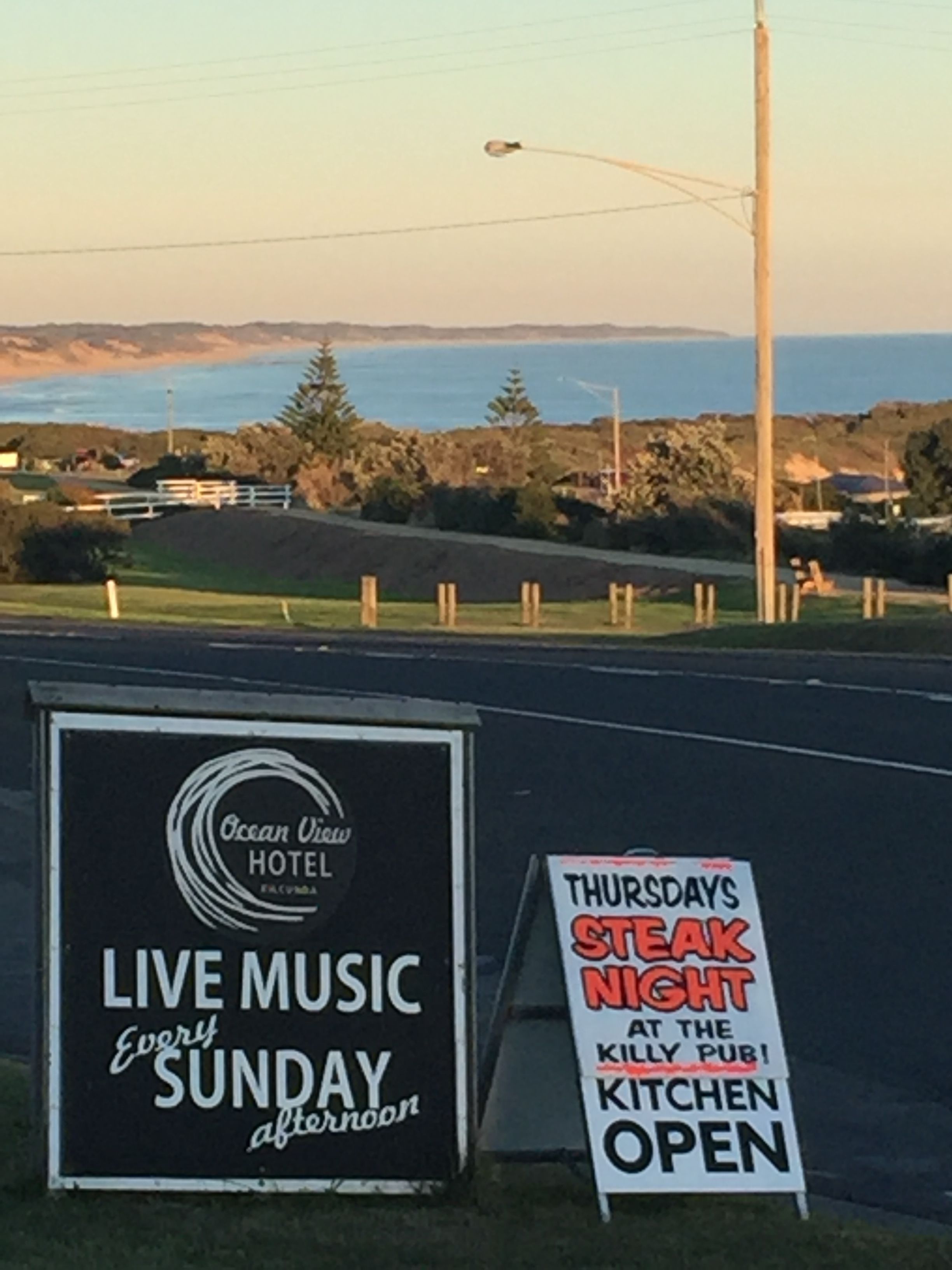 A sign for Ocean View Hotel advertising live music every Sunday afternoon.