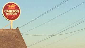 A building with a sign reading "Carlton Draught."