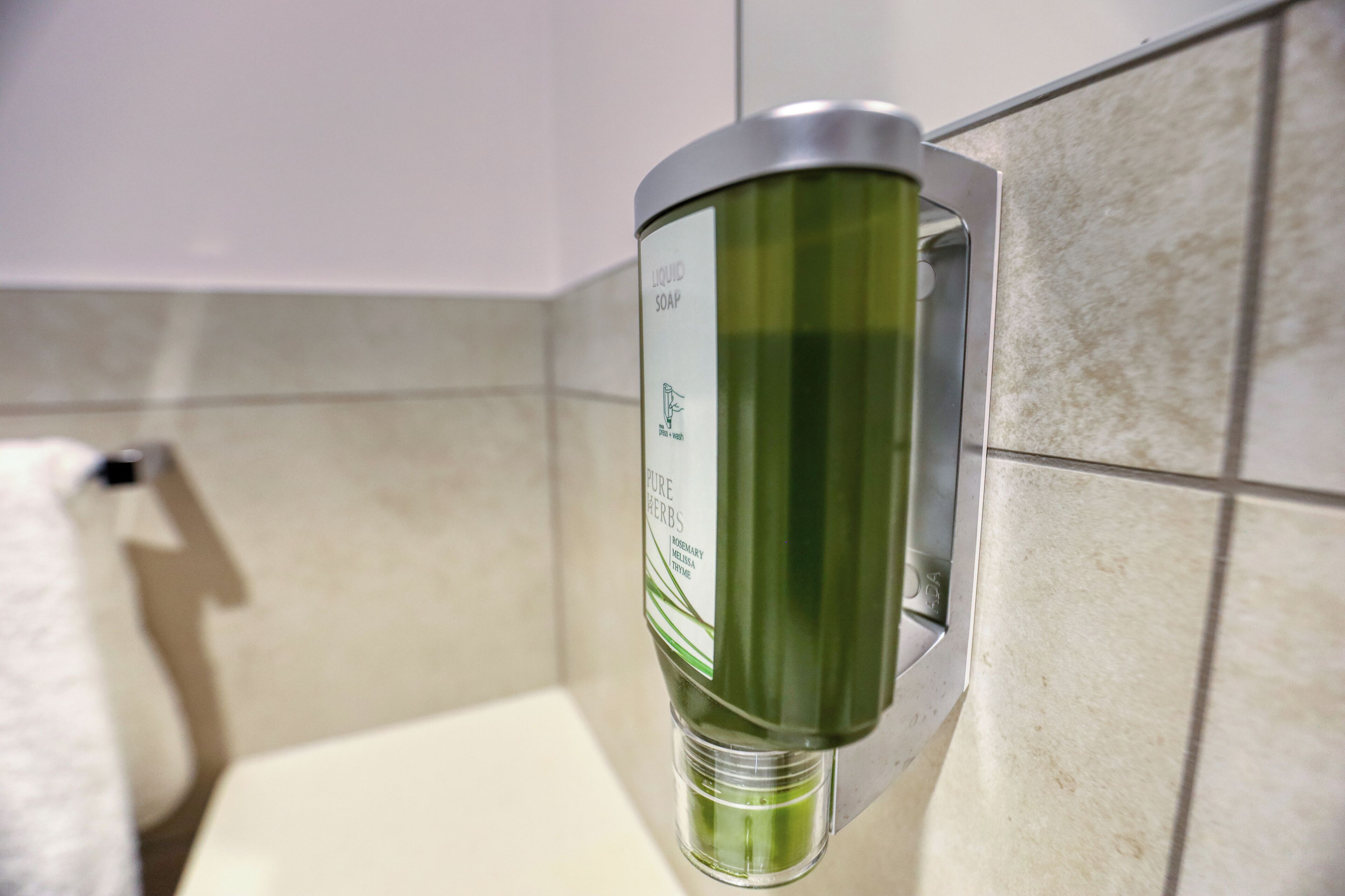 deluxe studio suite | bathroom | shower, eco-friendly toiletries, hair dryer, towels