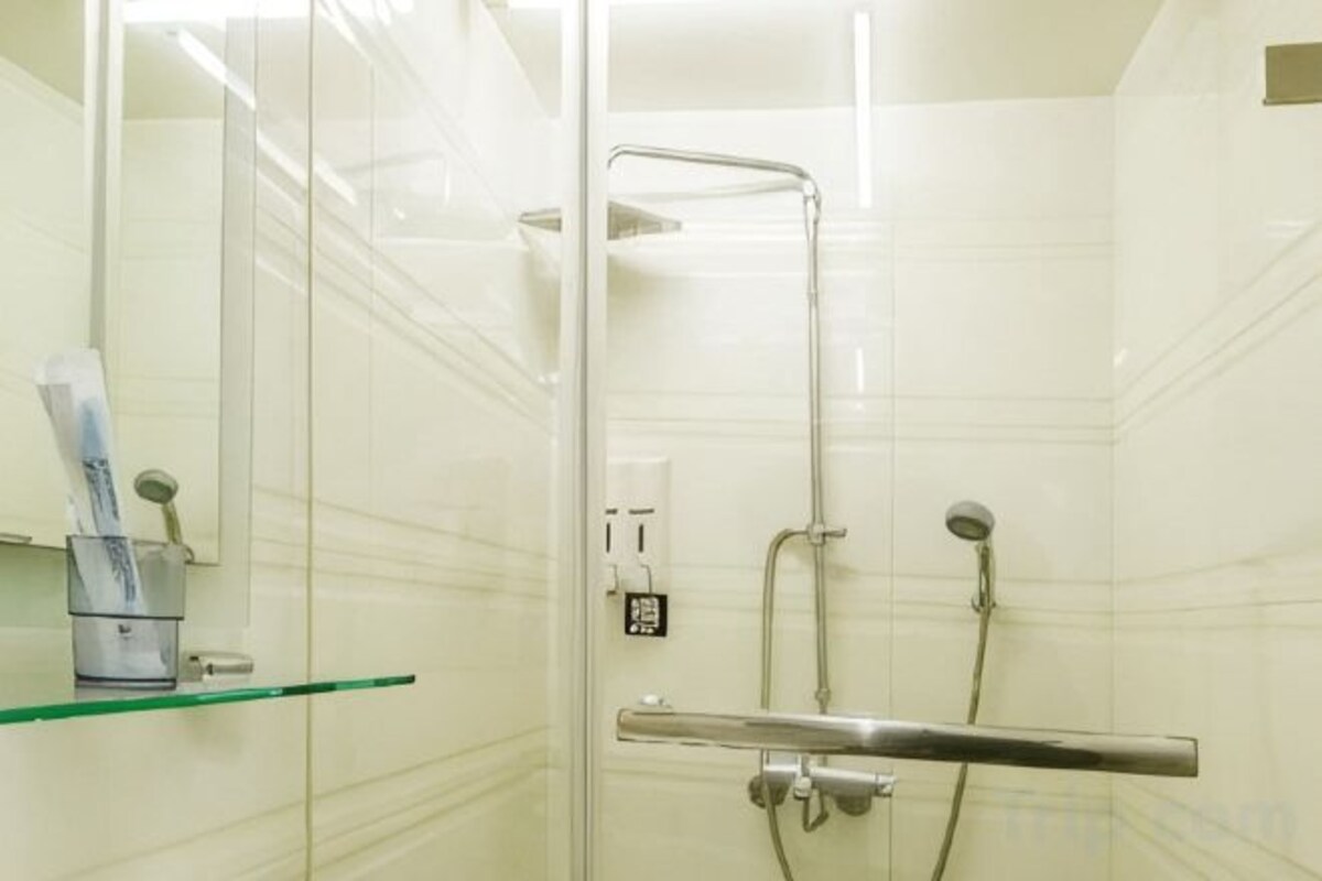 Bathroom | Shower, rainfall showerhead, hair dryer, slippers