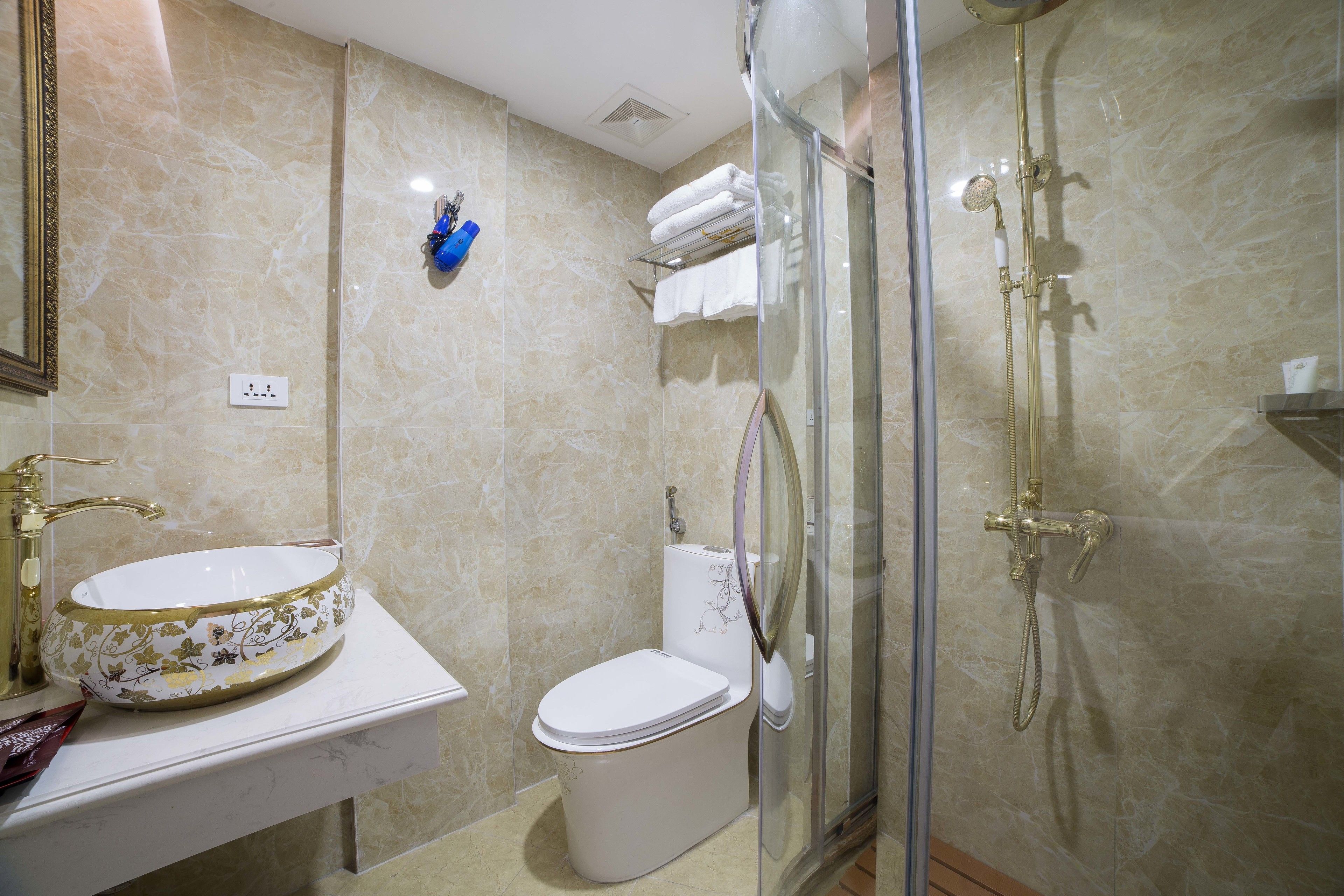 deluxe double room | bathroom | shower, free toiletries, hair dryer, dressing gowns