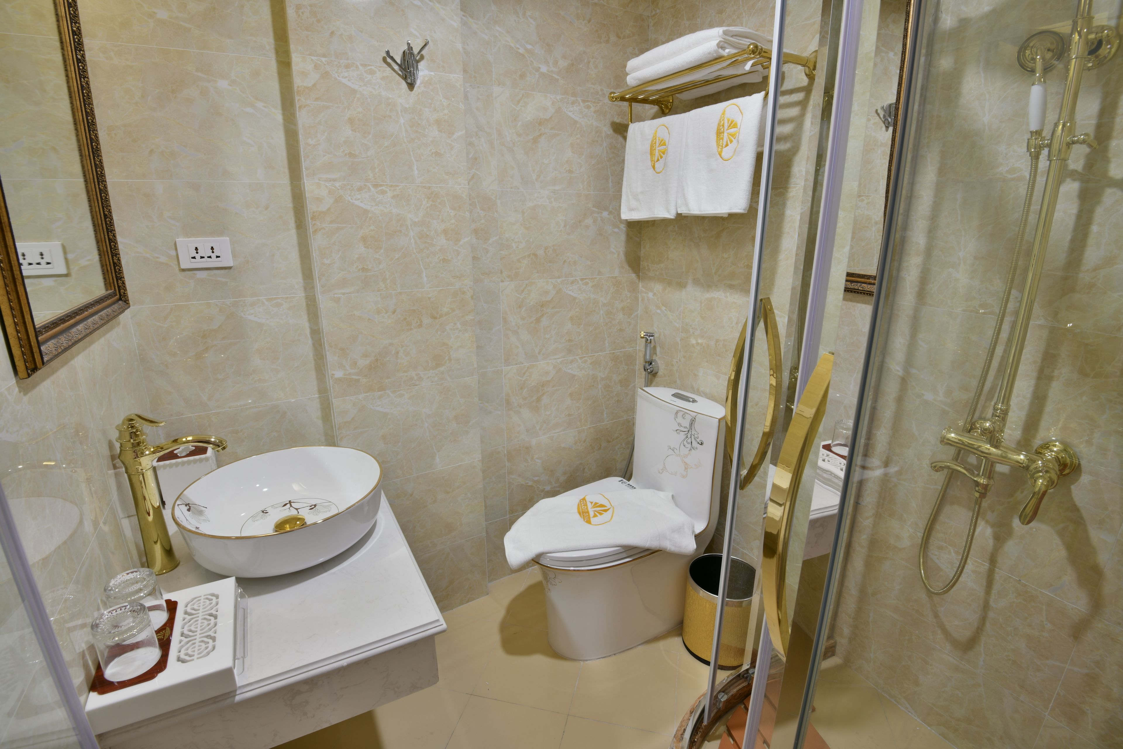 superior twin room | bathroom | shower, free toiletries, hair dryer, dressing gowns