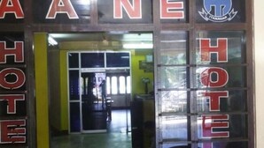 A hotel entrance with a sign that reads "ITANAGAR HOTEL". - Hotel Aane (Papumpare)
