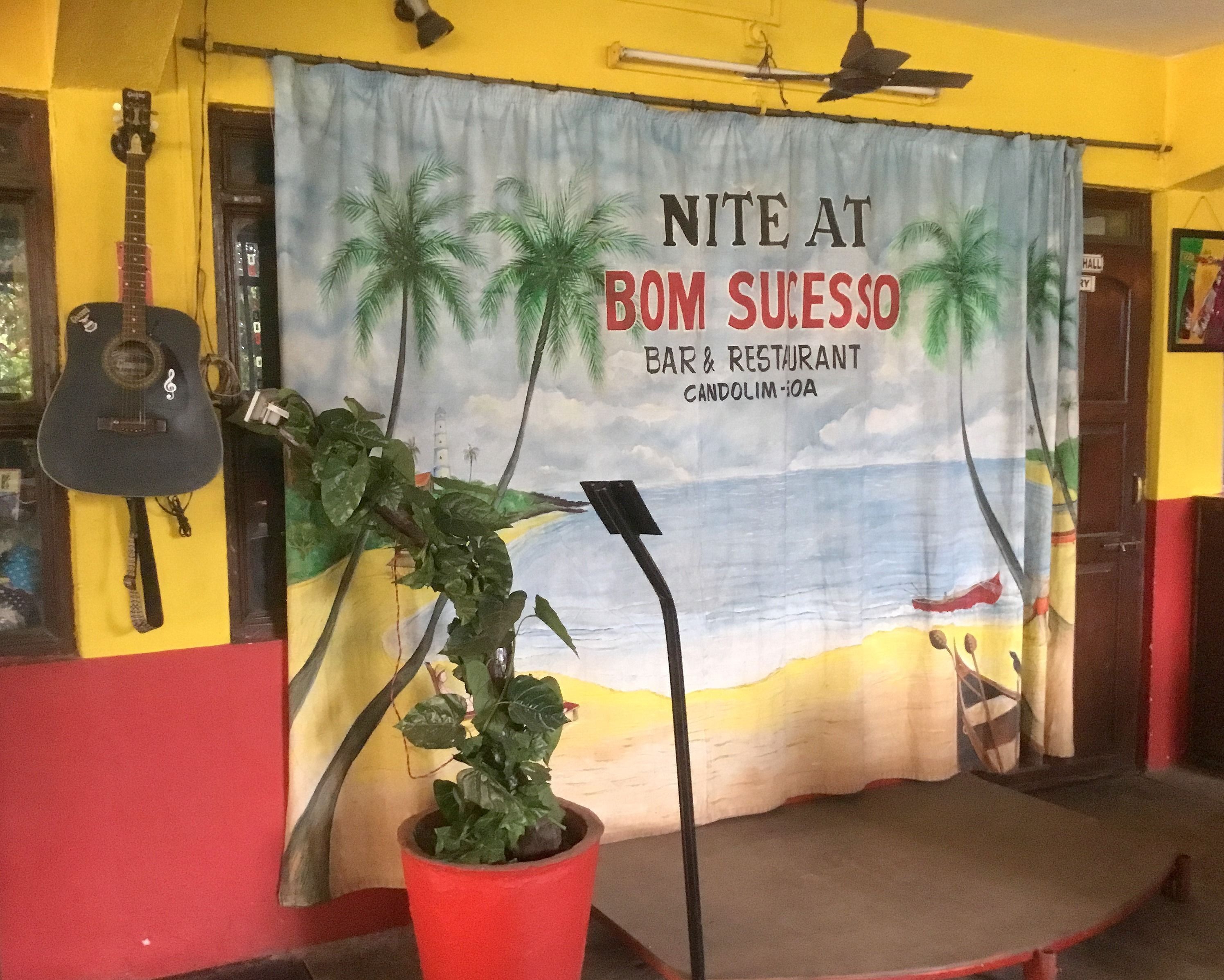 A banner for 'Nite at Bom Sucesso Bar & Restaurant' with a beach scene.