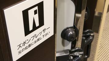 A door with a sign indicating a room number and a lock mechanism.