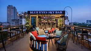 A rooftop bar named "Blue Eyes Sky Bar" with outdoor seating and a city view. - Shining Central Hotel & Spa (Hanoi)