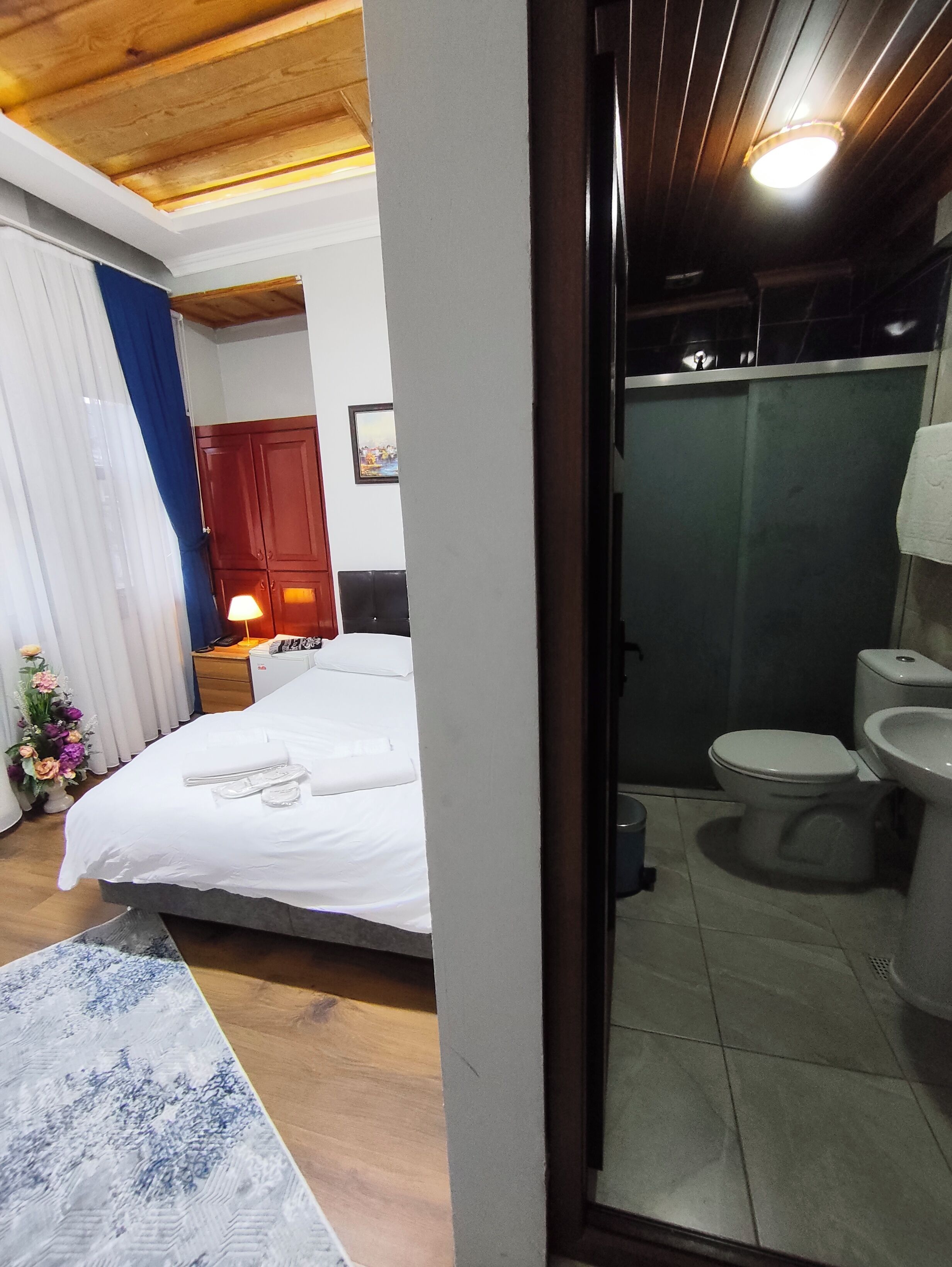 Standard Double Room | Bathroom | Shower, hair dryer, slippers, towels