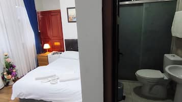 Standard Double Room | Bathroom | Shower, hair dryer, slippers, towels