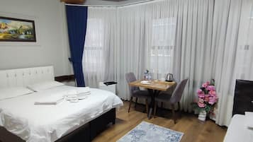 Desk, blackout drapes, soundproofing, iron/ironing board