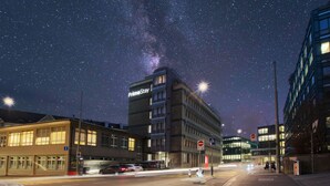 A building with a sign reading "PrimeStay" under a starry night sky. - Work Life Residence  (Winterthur)