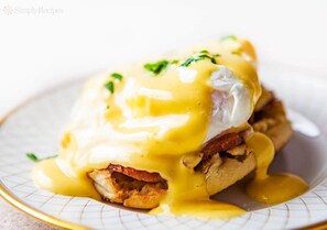 A plate of eggs benedict with hollandaise sauce and poached eggs. - Gigha Hotel (Isle of Gigha)