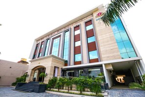 A modern hotel with a prominent entrance, large windows, and a well-maintained exterior. - Hotel Stella Continental (Phillaur)